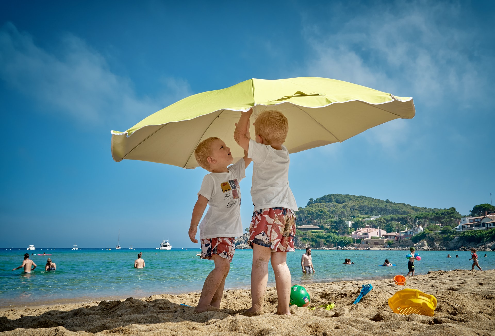 two children under the umbrella